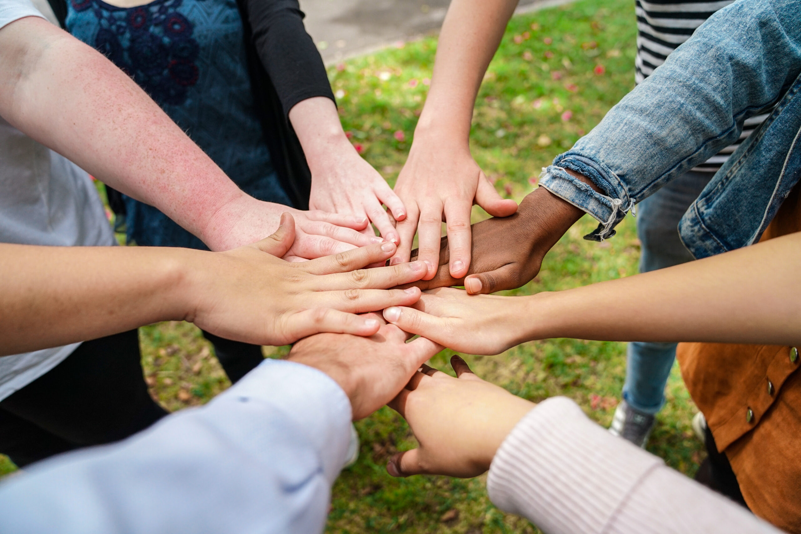 Team,Stacking,Hands,In,Unison
